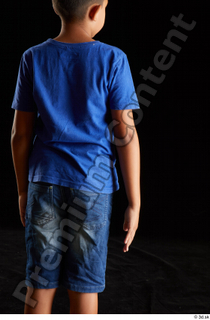 Timbo  1 arm back view blue t shirt dressed…